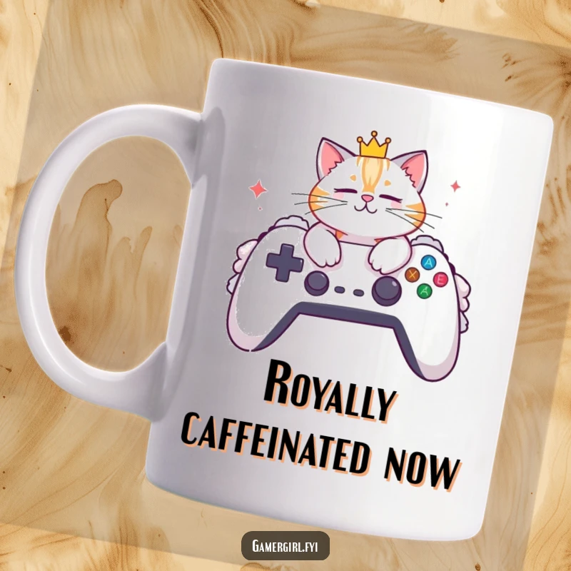 Funny mug featuring a stylish cat adorned with a small crown, lounging regally on an oversized, fluffy gaming controller.